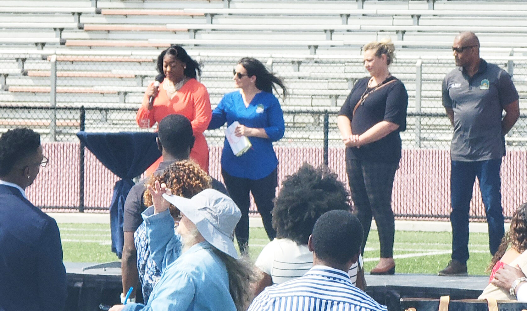 Councilwoman Erica Avila presents the Bronco Legacy Community Service Award to Councilwoman Patricia Fairclough-Staggers.